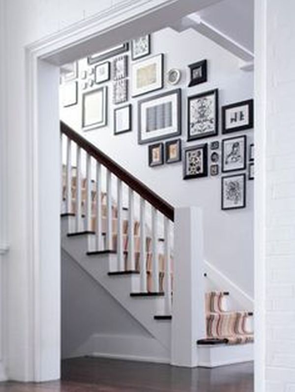 hang your kids' photos is the staircase wall