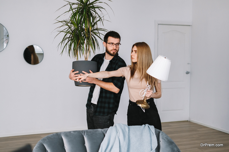 Young couple Decorating Home