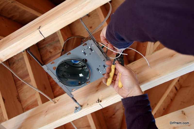 electrician installing light box